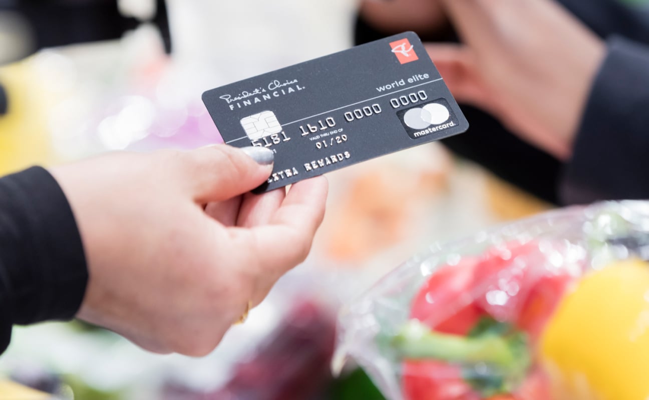 Person holding a PC Financial mastercard.