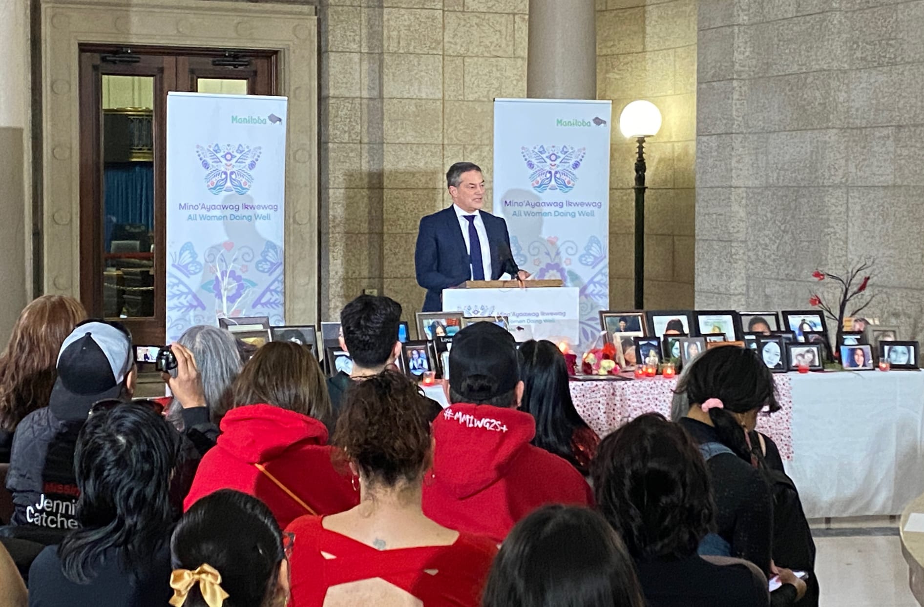 Jeff Leger stands at a podium making the announcement for the $10M donation. 