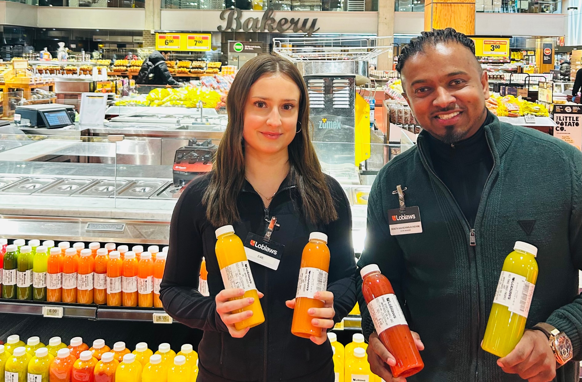 A photo of Evie and Denneth inside the Loblaws store.