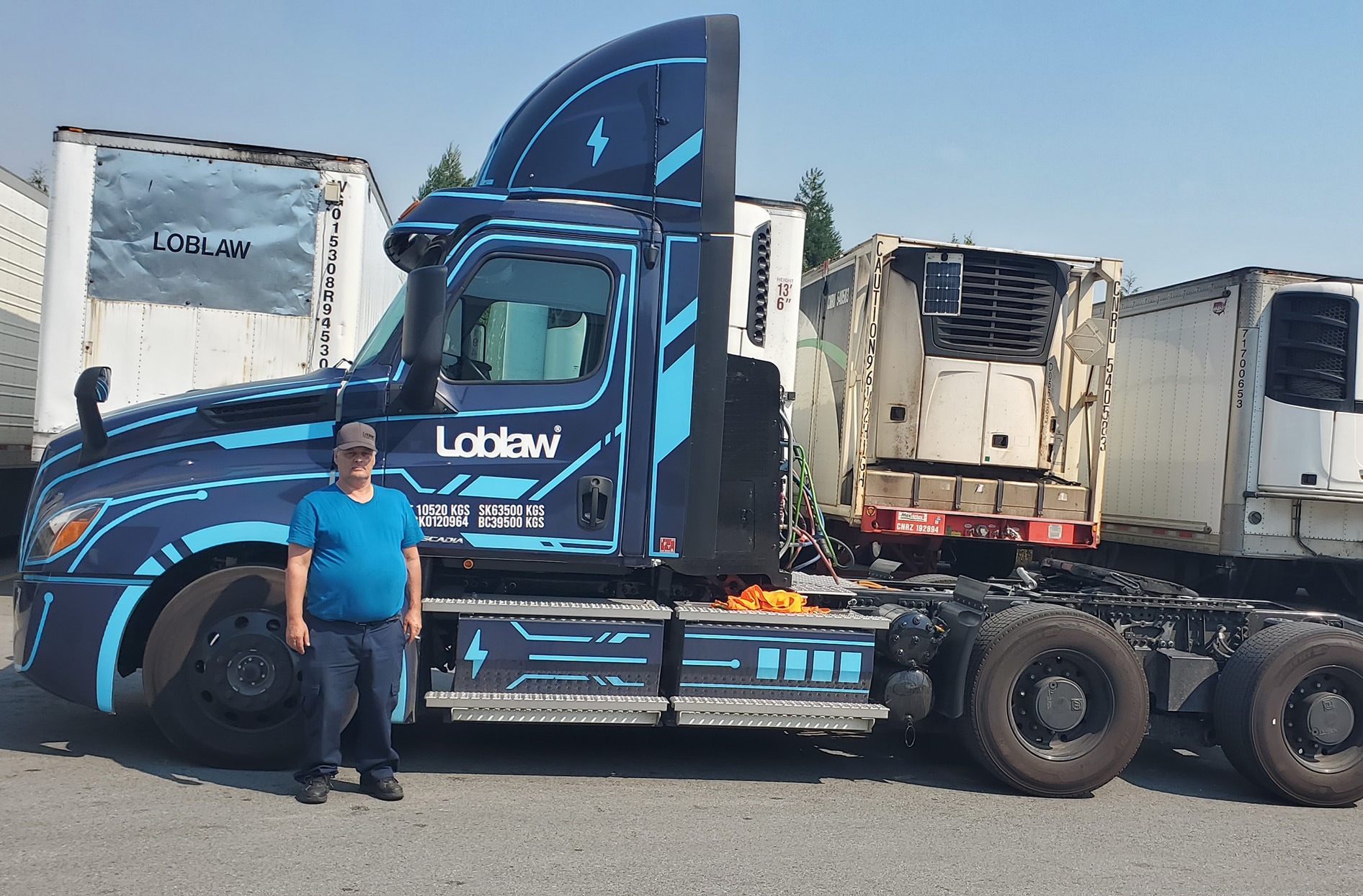 Richard stands in front of the Loblaw Freightliner eCascadia 