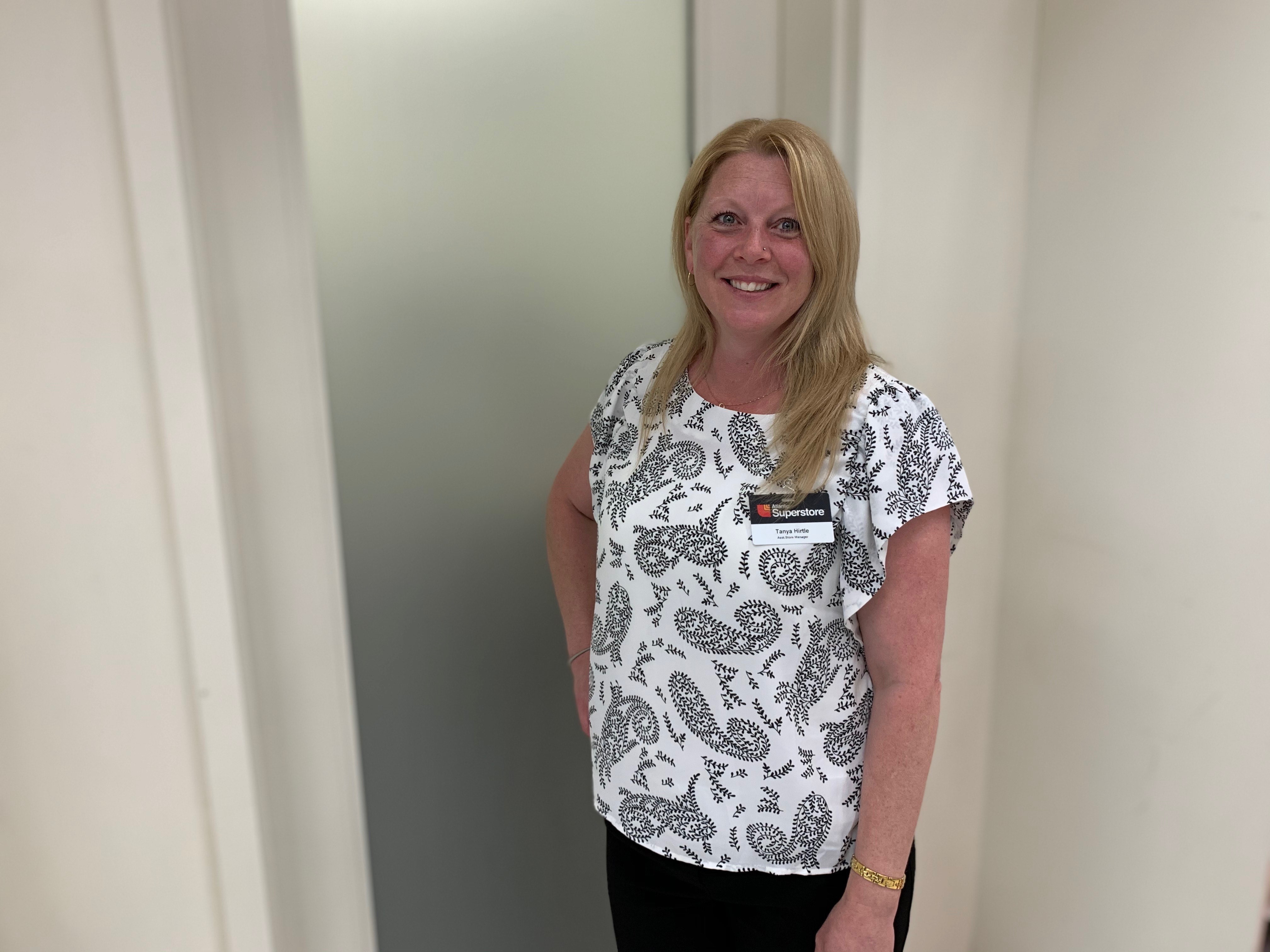 Tanya Hirtle, a blond woman, standing in a doorway.