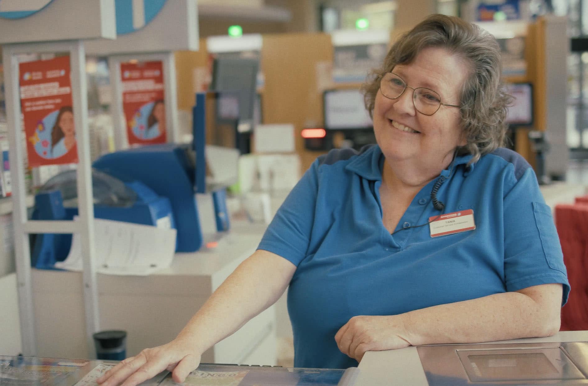 Shoppers Drug Mart cashier Tania Norris, is interacting with a customer during checkout.