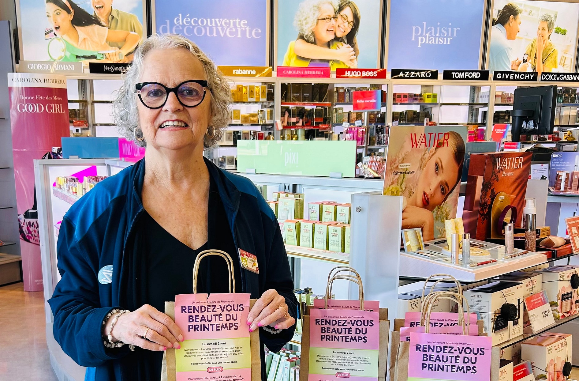 Sylvie smiling standing inside a Shoppers Drug Mart.