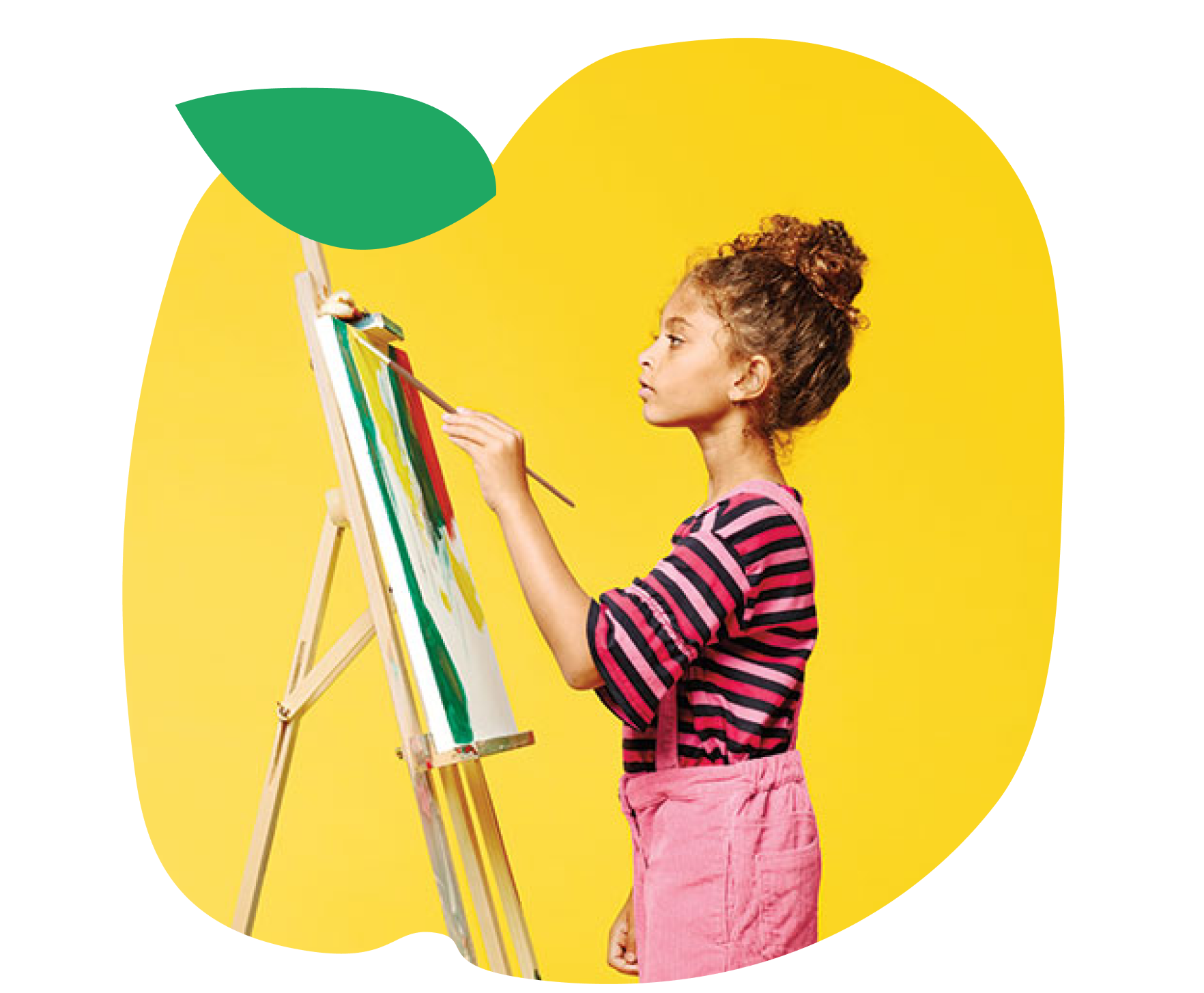 Young girl in pink painting on an easel