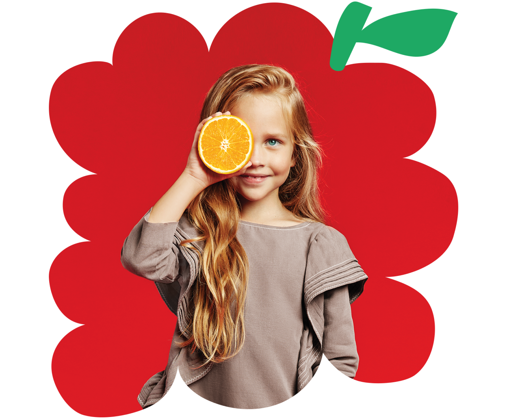 Young girl holding orange up to her eye