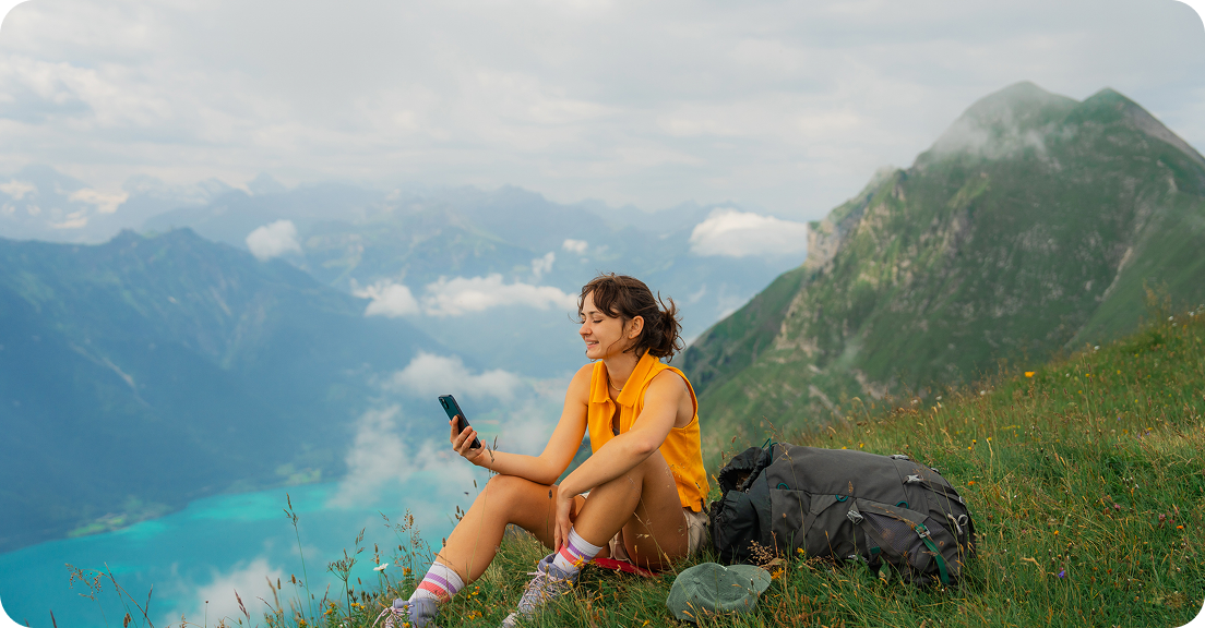 Girl with a PC Mobile phone in the nature