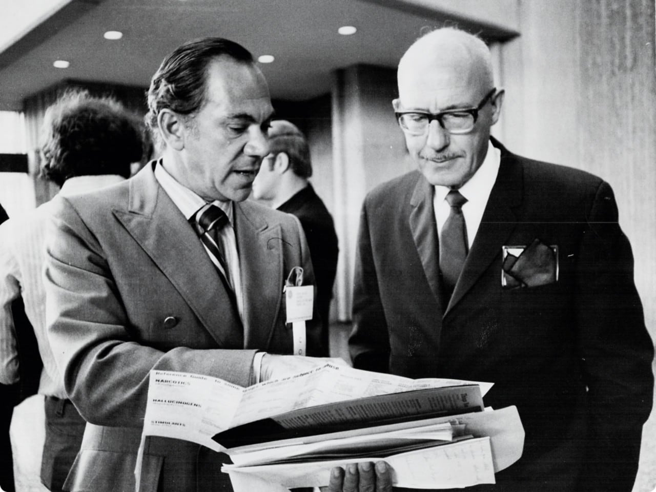 Black and white old photo of 2 men in suits